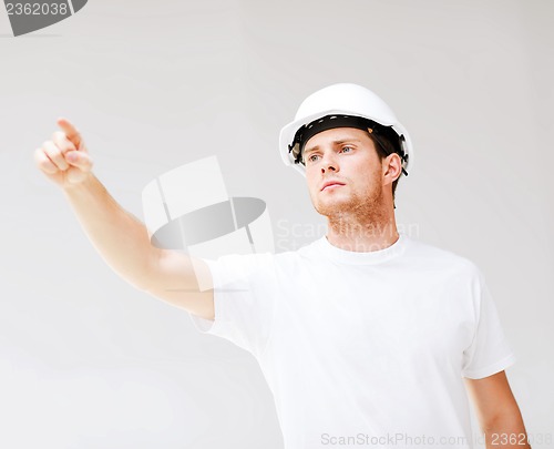 Image of male architect looking at blueprint