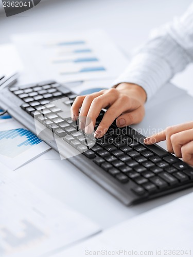 Image of woman hands typing on keyboard