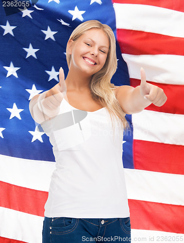 Image of teenage girl in blank white t-shirt with thumbs up