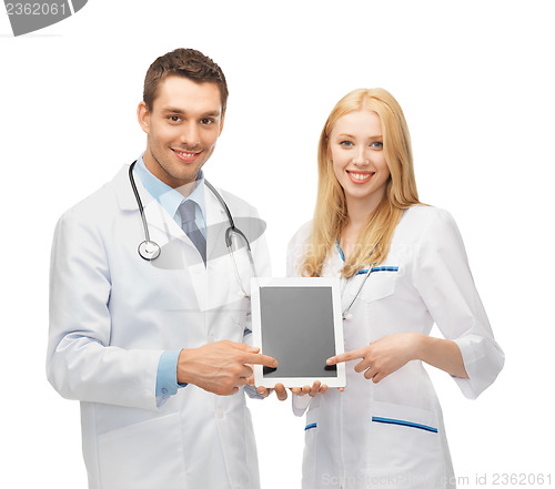 Image of young doctors pointing at tablet pc