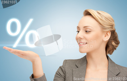 Image of woman showing sign of percent in her hand