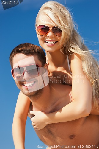 Image of couple having fun on the beach