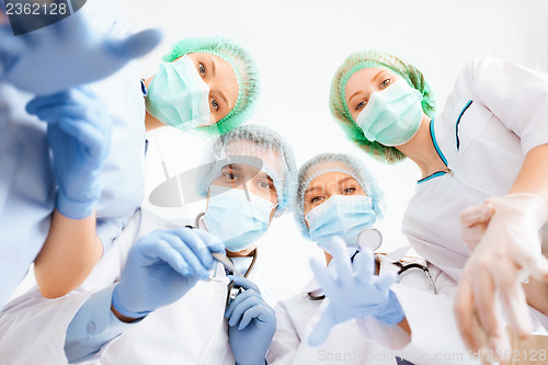 Image of group of doctors in operating room