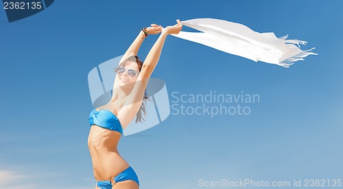 Image of woman in bikini and sunglasses