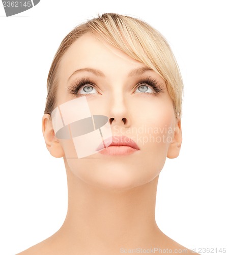 Image of beautiful woman looking up