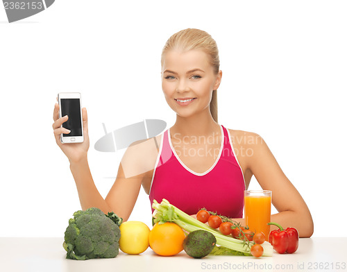 Image of woman with fruits, vegetables and tablet pc