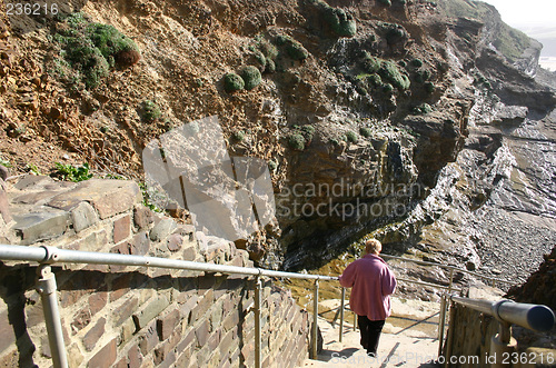 Image of female on steps