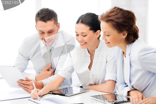 Image of business team working with tablet pcs