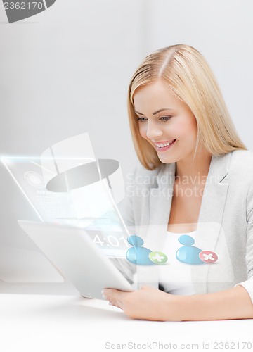 Image of businesswoman looking at tablet pc