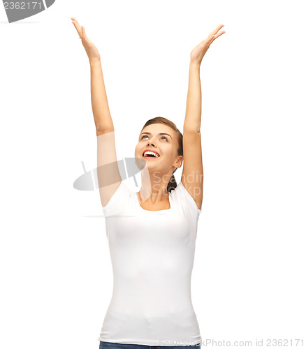 Image of happy woman with hands up