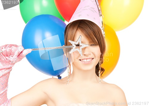 Image of happy girl with colorful balloons