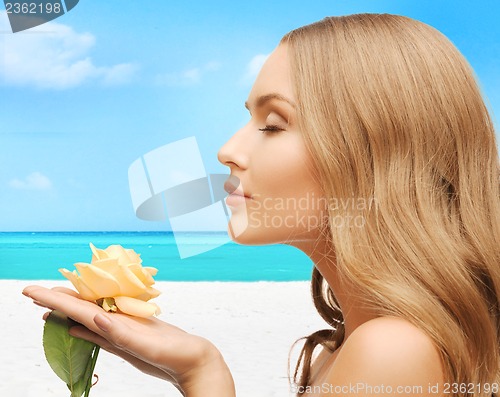 Image of lovely woman with rose flower