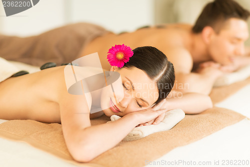 Image of couple in spa with hot stones