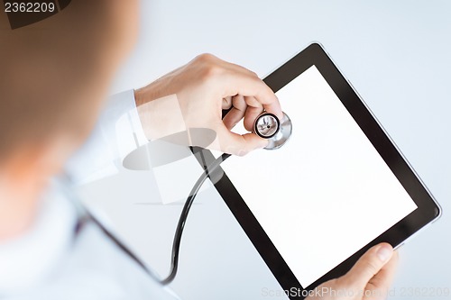 Image of doctor with stethoscope and tablet pc