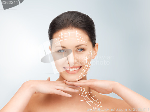 Image of face and hands of beautiful woman