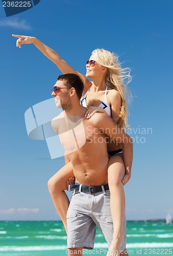 Image of couple having fun on the beach