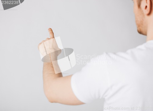Image of man hand pointing at something