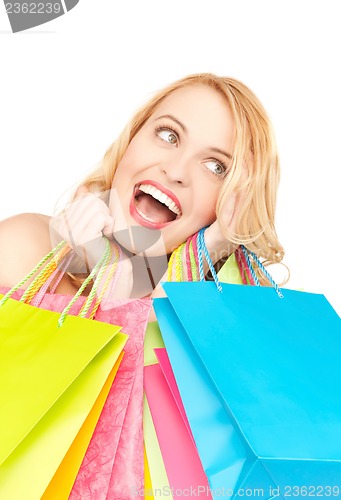 Image of excited woman with shopping bags