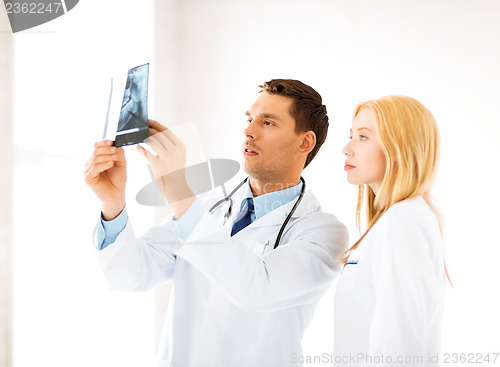 Image of two doctors looking at x-ray