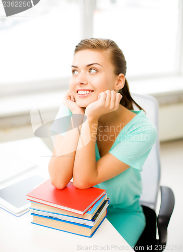 Image of happy smiling student girl with books