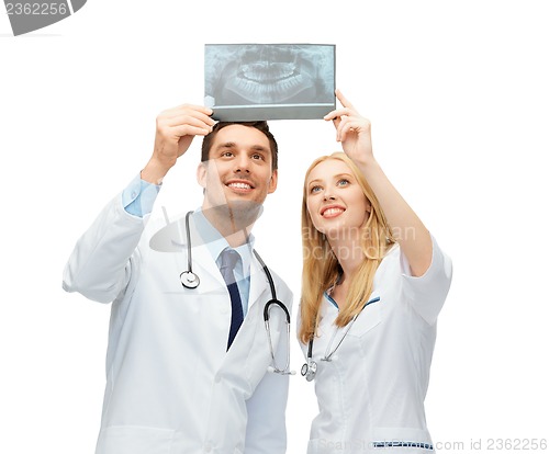 Image of two doctors looking at x-ray