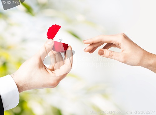 Image of couple with wedding ring and gift box