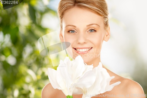 Image of lovely woman with lily flower