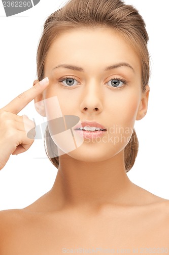 Image of woman touching her face skin