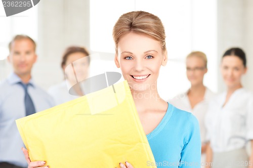 Image of businesswoman with parcel