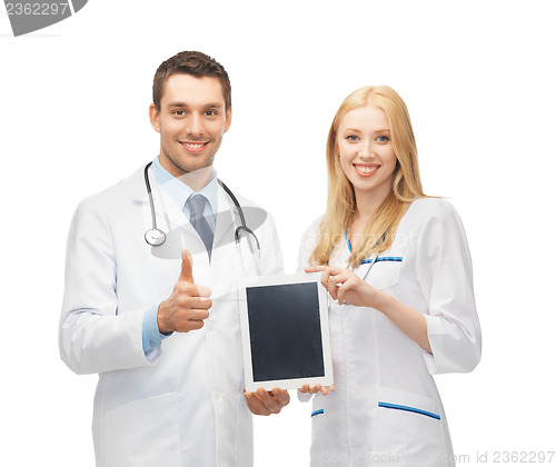 Image of young doctors holding tablet pc in hands