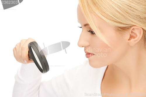 Image of female scientist working with magnifier