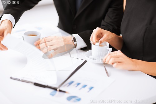 Image of woman hand signing contract paper