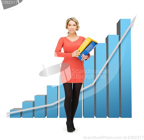 Image of businesswoman with big 3d chart and folders