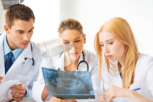 Image of young group of doctors looking at x-ray