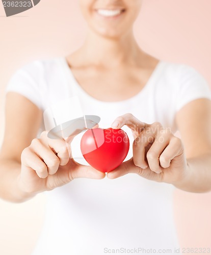 Image of woman hands with heart
