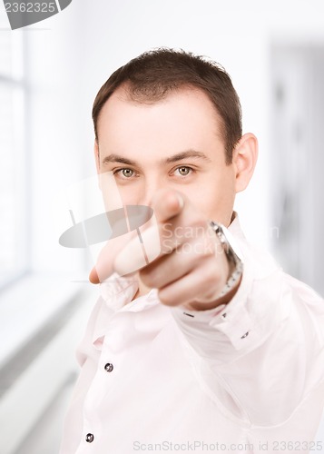 Image of businessman pointing his finger