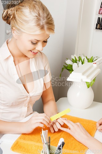 Image of woman making a manicure at the salon