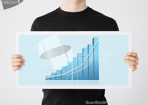 Image of woman holding board with 3d graph