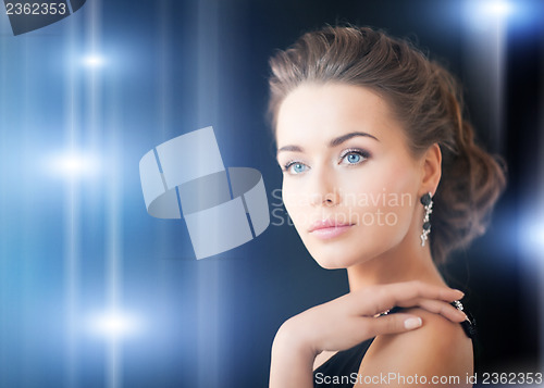 Image of woman with diamond earrings