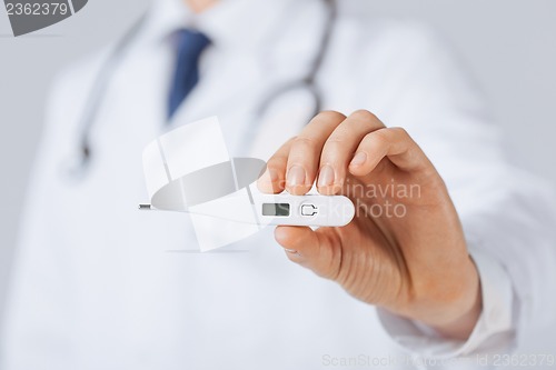 Image of male doctor with thermometer