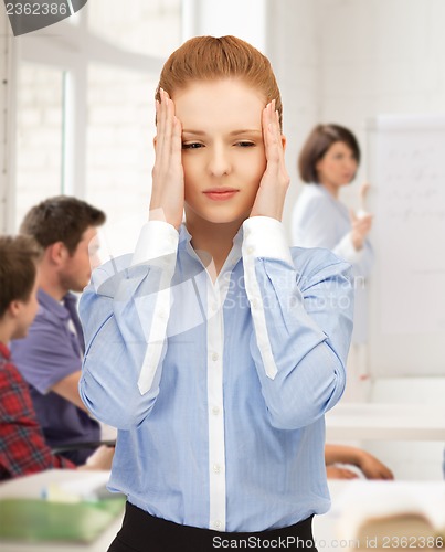 Image of girl with headache at school