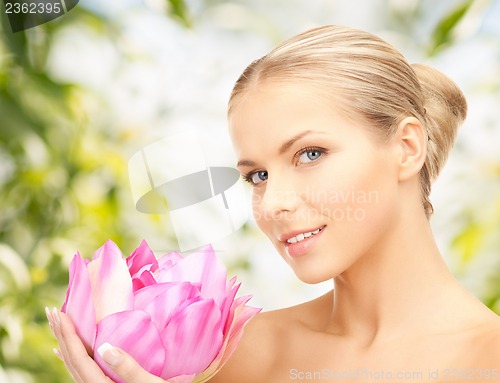 Image of beautiful woman with lotus flower
