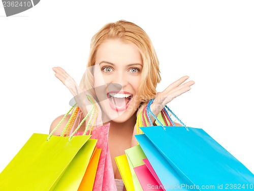 Image of excited woman with shopping bags