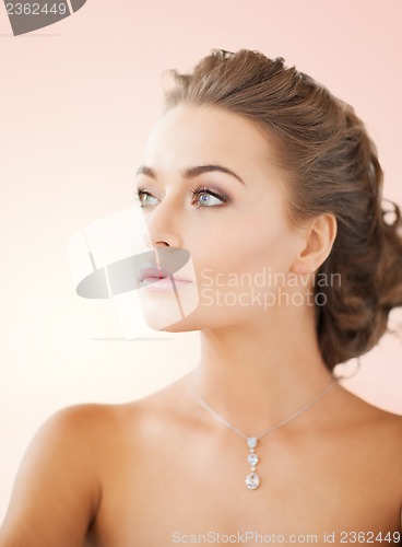 Image of woman wearing shiny diamond necklace