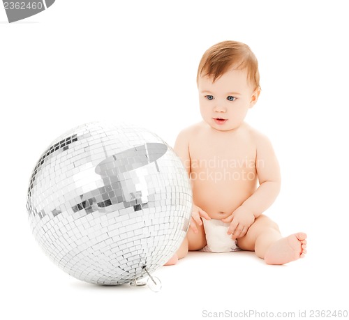 Image of child playing with disco ball