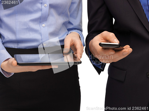 Image of hands with smartphones and tablet pc