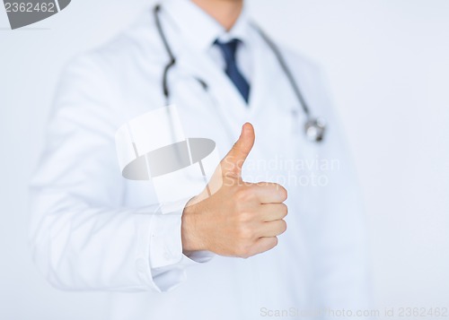 Image of male doctor hand showing thumbs up