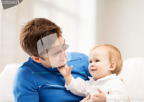 Image of happy father with adorable baby