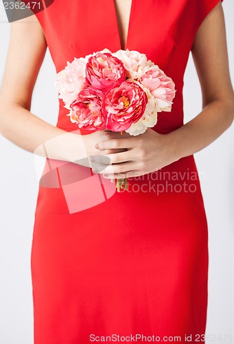 Image of woman hands with bouquet of flowers