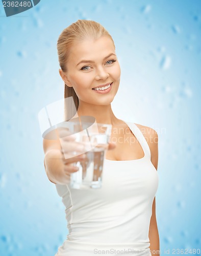 Image of young smiling woman with glass of water